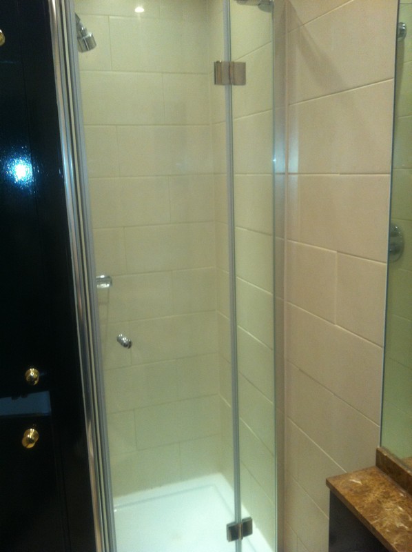 Frameless glass shower enclosure with chrome fittings in Aylesbury